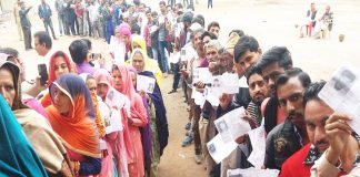 page3news-Voters queued up outside a polling booth